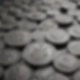 A close-up of various silver coins displaying different designs.